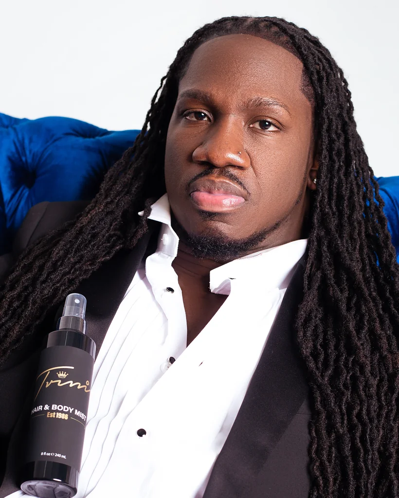 Male entrepreneur photographed with his branded hair and body product