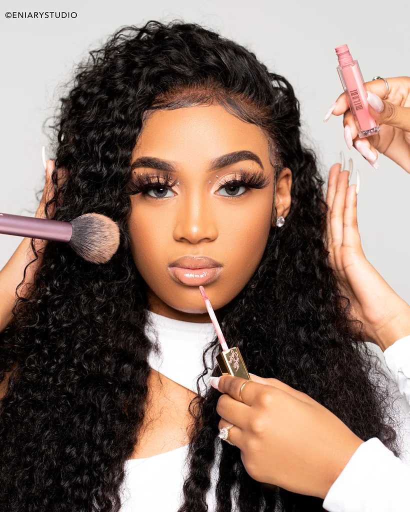 Beauty professional surrounded by makeup tools in a polished personal branding campaign portrait