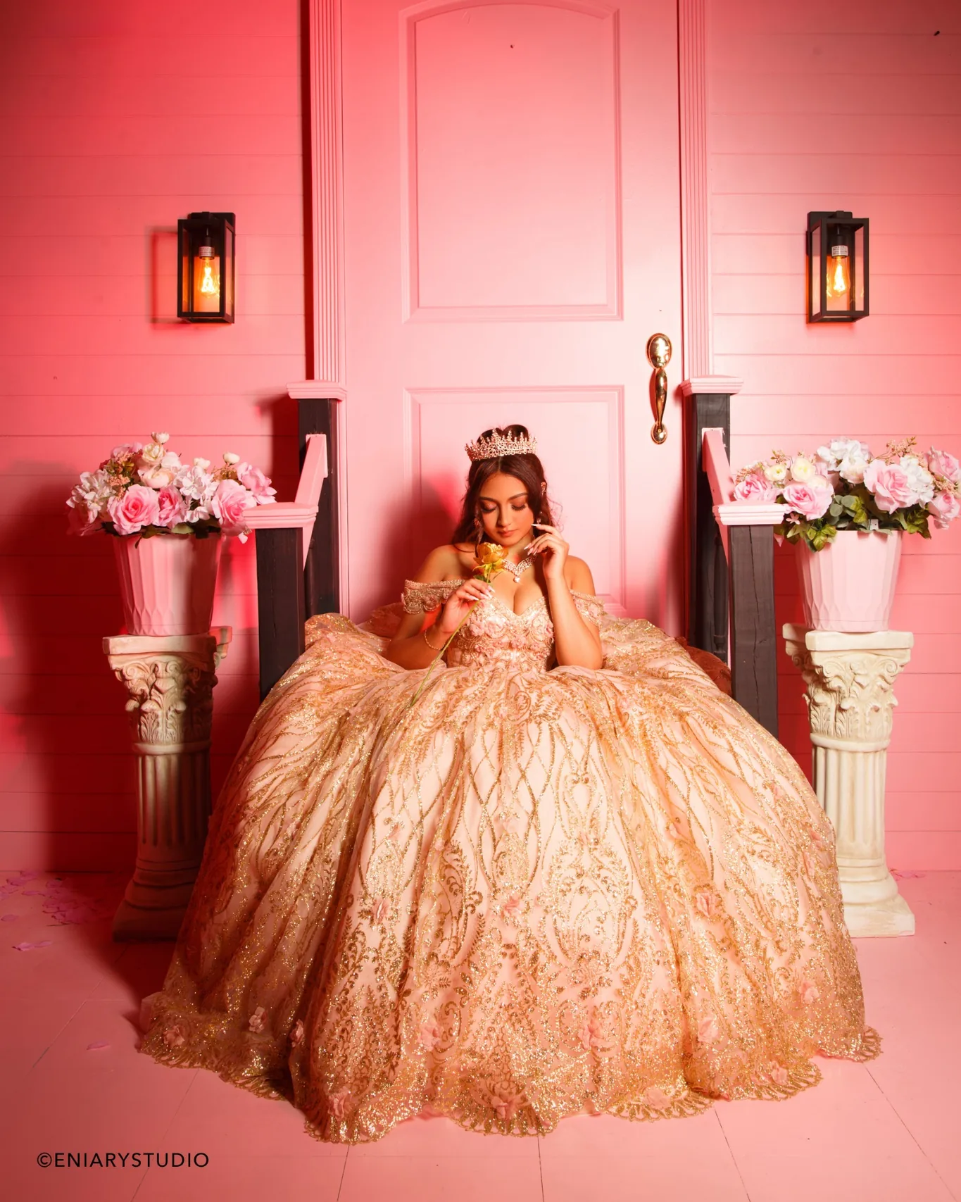 Quinceañera in a full blush gown on a floral princess set