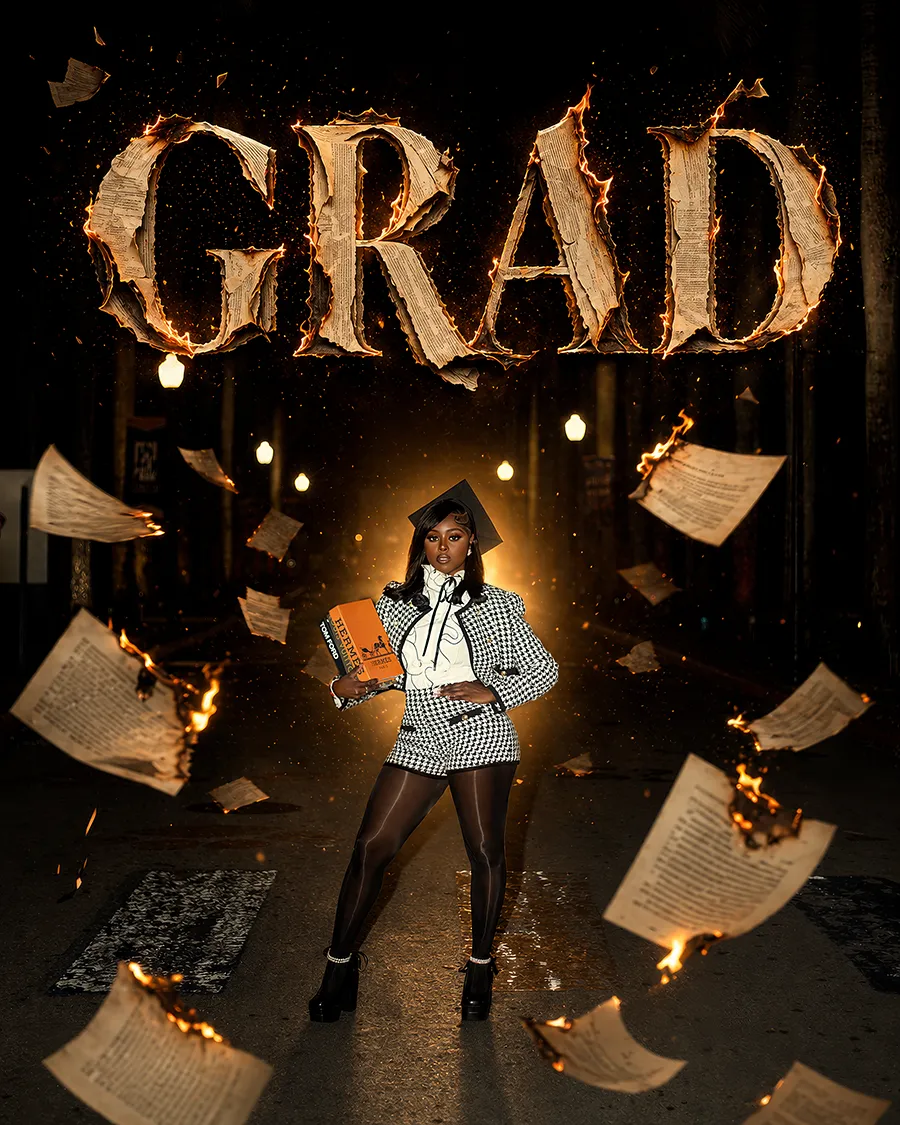 Creative graduation portrait with dramatic fire effects